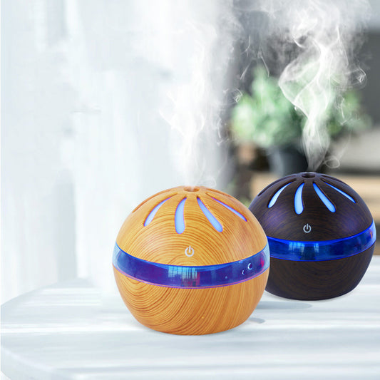 Windmill Humidifier USB aroma diffuser displaying two colors with steam rising, enhancing home ambiance.